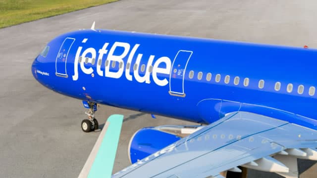 JetBlue unveiled its new domestic first-class seat with more space, Bluetooth, and customizable cocktails. Take a look.